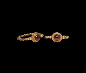 Lot 498, Medieval Gold Twisted Ring with Garnet
