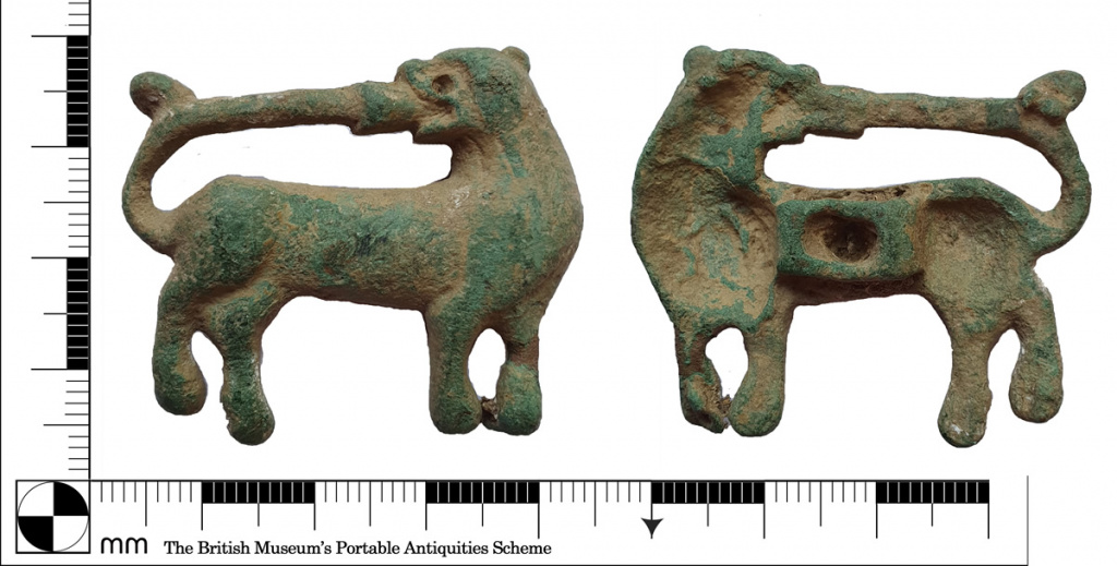 Medieval mount of dog biting its tail