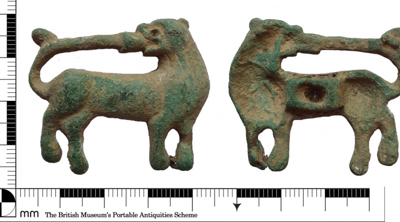 Medieval mount of dog biting its tail