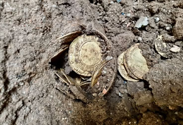 coins in the ground